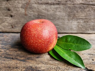 Ripe apple on wood background
