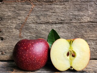 Ripe apple on wood background