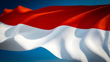 Naklejka premium Indonesian flag waving the red and white flag represents symbol of courage and purity