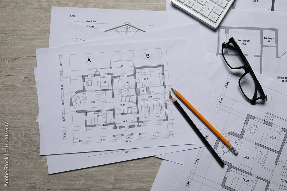 Poster Different architectural drawings, calculator, glasses and pencils on wooden table, top view