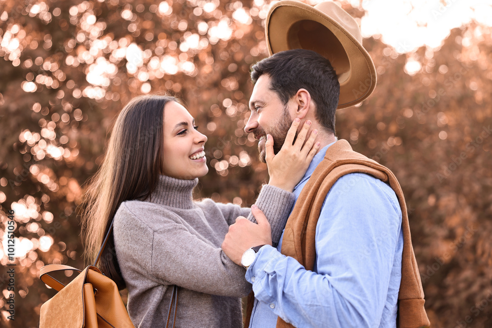 Wall mural Beautiful couple spending time together outdoors on autumn day