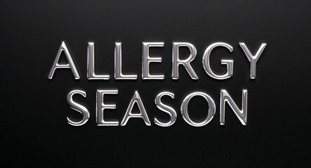 allergy season silver shining shiny solid metallic lettering on plain black background