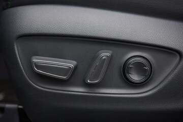 Naklejka premium Explore the intricate functions of premium luxury car seat control buttons in detail