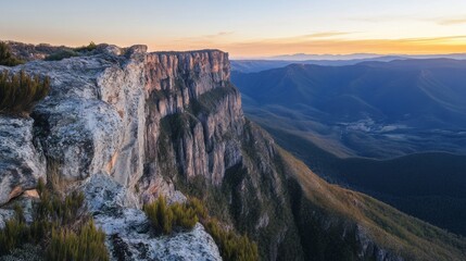 Majestic Mountain Cliffs and Valley at Sunset
