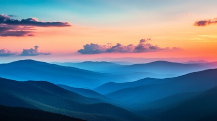 Obraz premium Mountain Range Silhouetted Against a Vibrant Sunset Sky