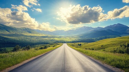 A peaceful asphalt road running through green mountain landscapes, with a sunny sky and scattered, fluffy clouds.