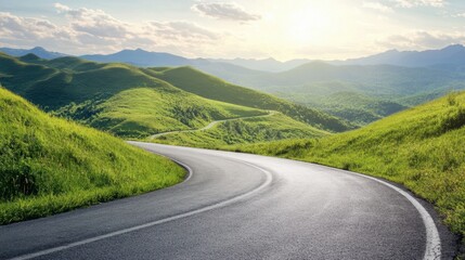 Fototapeta premium An asphalt road curving through green mountain terrain, with a clear sky and light, fluffy clouds on a bright, sunny day.
