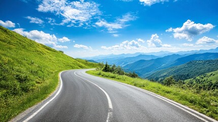 An asphalt road winding through green mountain valleys, with a clear blue sky and scattered clouds on a sunny day.