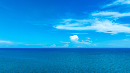 Nature of the beach and sea Summer with sunshine, sandy beaches, clear blue waters sparkling against the blue sky. On an island with good ecology and environment Background for summer vacation concept