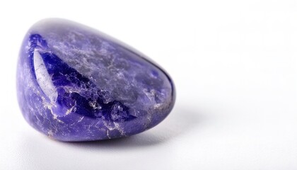 Tanzanite is the blue and violet variety of the mineral zoisite noted for its strong trichroism, appearing alternately blue, violet and burgundy depending on crystal orientation. Isolated on white