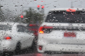 car on highway road with rainny season, blurred image