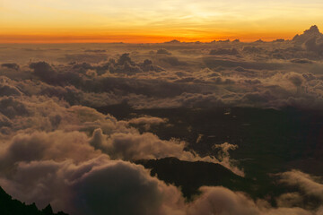 Sunset in the mountains above the clouds