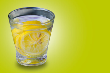 glass of water with lemon. water infused on yellow background,  suitable for drink campaign background