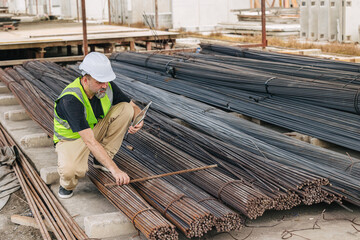 Engineer worker, Officer working check steel bar strength grade for high quality products and...