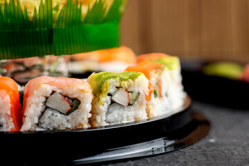 Sushi cake consists of uramaki sushi and norimaki sushi. Perfect for recipe, article, catalogue, or any commercial purposes.