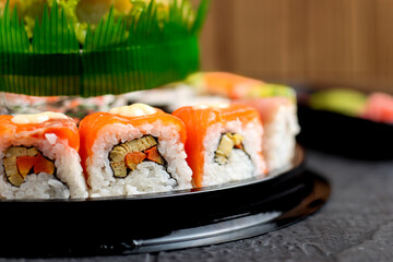 Sushi cake consists of uramaki sushi and norimaki sushi. Perfect for recipe, article, catalogue, or any commercial purposes.