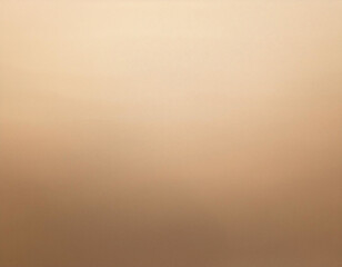 Fototapeta premium A neutral and calming background with a soft beige-to-brown gradient, ideal for creating a peaceful and relaxing atmosphere