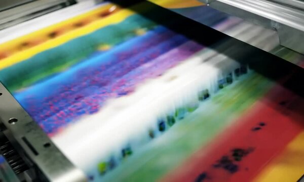 Printed sheet in process on offset printing machine