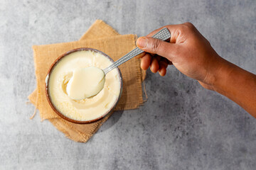 Misti doi is a traditional Bengali sweet yogurt made by caramelizing milk and sugar, known for its creamy, rich flavor. Selective focus.