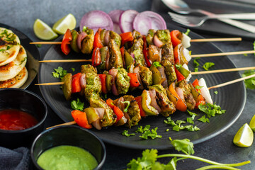 Selective focus of Succulent Hariyali Chicken Tikka Kabab, A Flavorful Blend of Herbs, Spices, and Grilled to Perfection