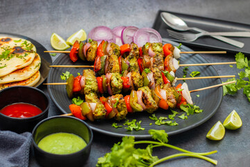 Selective focus of Succulent Hariyali Chicken Tikka Kabab, A Flavorful Blend of Herbs, Spices, and Grilled to Perfection
