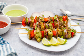 Selective focus of Succulent Hariyali Chicken Tikka Kabab, A Flavorful Blend of Herbs, Spices, and Grilled to Perfection