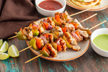 Chicken Reshmi Kabab is a succulent, marinated chicken dish, grilled to perfection, featuring a blend of spices, cream, and cashews. Selective focus.
