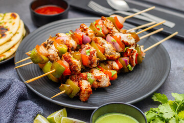 Chicken Reshmi Kabab is a succulent, marinated chicken skewer, grilled to perfection, featuring rich spices, creamy yogurt, and aromatic herbs.