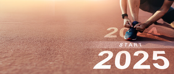 New year 2025 concept, beginning of success. Text 2025 written on asphalt road and male runner...