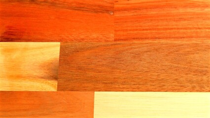Wooden surface with alternating light and dark grains, offering polished appearance with distinct patterns. Natural texture smoothly transitions between contrasting wood tones.