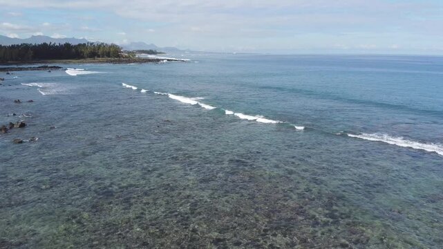 Aerial view in Mauritius over Pointe aux Piments beach, a beautiful tropical beach in the Indian Ocean