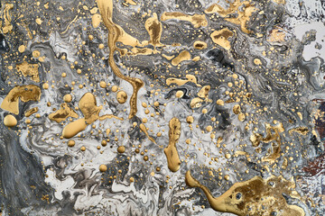 Flowing shapes and delicate metallic touches, abstract artwork on together rich tones and golden highlights. The liquid ink technique create fluidity, feeling of depth,  beauty