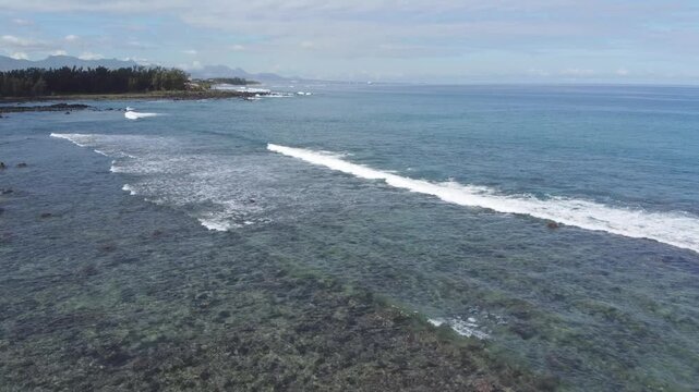 Aerial view in Mauritius over Pointe aux Piments beach, a beautiful tropical beach in the Indian Ocean