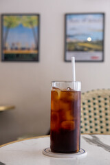A glass of iced americano on the table