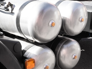 Air brake system of the truck. Black receivers with compressed air. Parts of a truck close-up....
