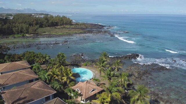 Aerial view in Mauritius over Pointe aux Piments beach, a beautiful tropical beach in the Indian Ocean