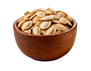 Pumpkin seeds piled in a wooden bowl, perfect for healthy snacking, with a white isolated background.