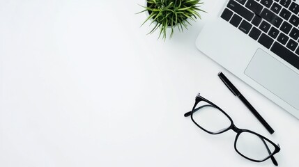 Minimalist Workspace with Laptop, Glasses, and Pen