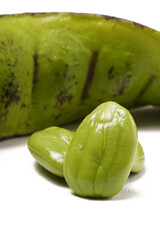 Fresh green stinky bean (petai) seeds and pods, ready for use in sambal, vegetables, or as a side dish. Photographed on a white background. Scientific name: Parkia speciosa.