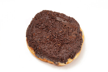 A whole donut without a hole, topped with hardened chocolate glaze and generously covered in chocolate sprinkles. Photographed on a white background.