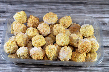 Frozen pre-fried Falafel, a deep-fried ball or patty-shaped fritter of Egyptian origin, made from broad beans, ground chickpeas, or both, Middle Eastern cuisine, popular street food in Arab countries