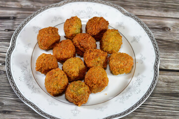 Fried chickpeas Falafel, a deep-fried ball or patty-shaped fritter of Egyptian origin, made from broad beans, ground chickpeas, or both, Middle Eastern cuisine, popular street food in Arab countries