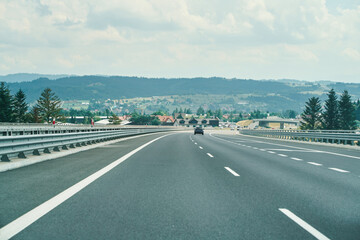 Highway road with cars and scenic background