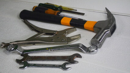 Mechanic's tool set includes hammer, screwdriver, wrench