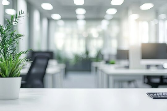 Blurred office background with a computer and white desk in a modern interior, a business work space concept, a mockup for product display presentation, with a white background