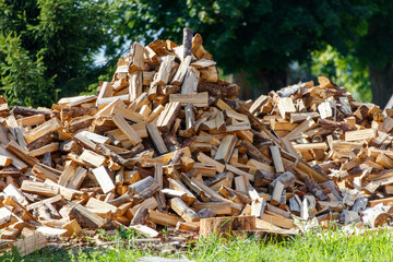 A pile of wood is stacked on top of another pile