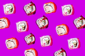 a lilac background with a pattern of sushi roll on it