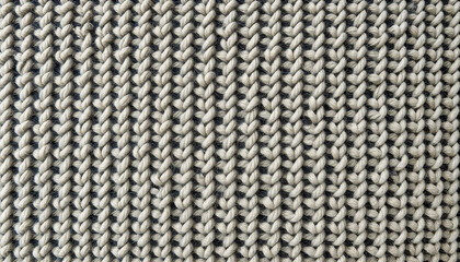 Close-up of knitted texture in beige and gray tones with cozy design, coarse wool texture