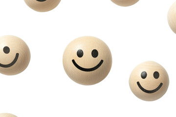 Wooden smiley faces floating against a black background, evoking feelings of happiness and joy.