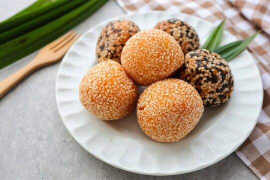 Sesame Balls,B&aacute;nh cam,Kuih Bom Keledek in white plate on cement background